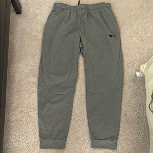 Nike Gray Sweatpants with Elastic Waistband and Tapered Cuffs